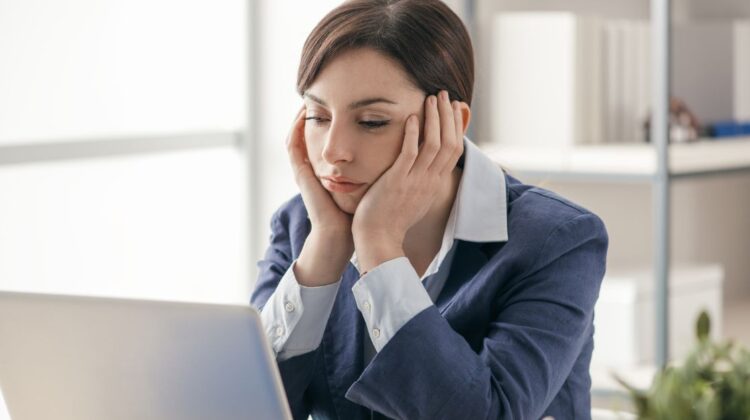 businesswomen unhappy at desk